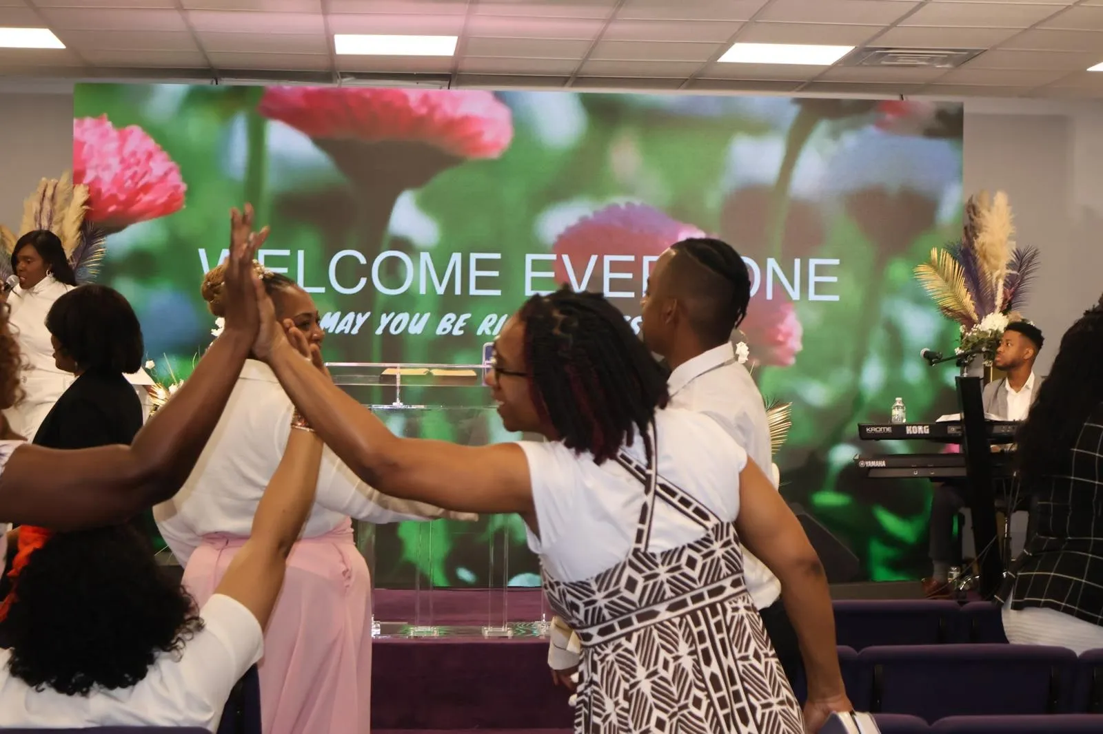 Members of the congregation greeting one another before a service